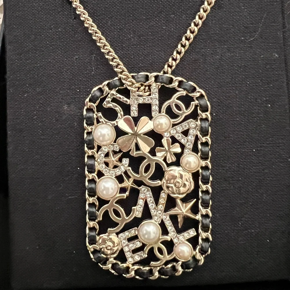 CHANEL Pendant Necklace Clover Lambskin Leather Chain Logo Crystal Mosaic Pearl